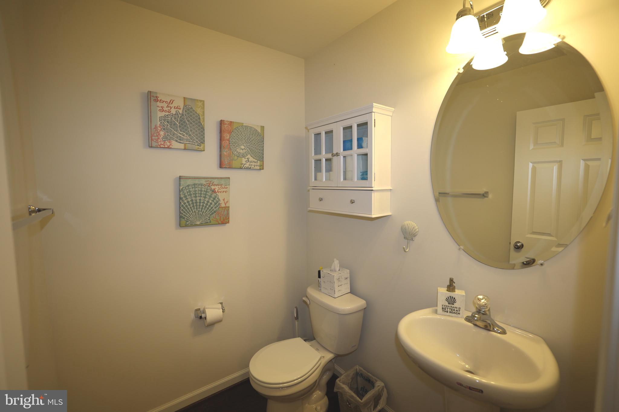 130 Intrepid Lane Berlin, MD 21811 - Photo 9 of 18 a bathroom with a toilet sink and mirror