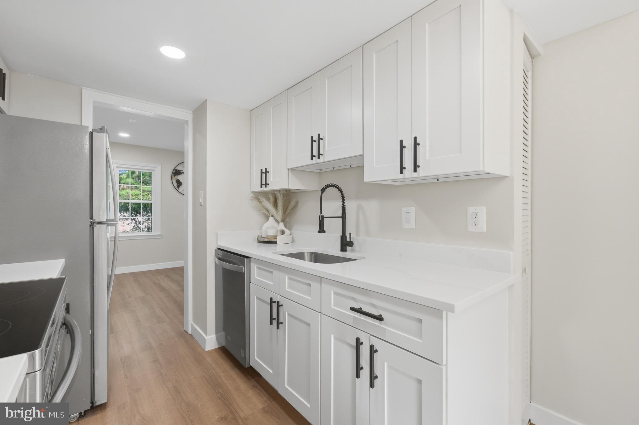 8575 Tyrolean Way Springfield, VA 22153 - Photo 10 of 29 a kitchen with cabinets a sink and appliances
