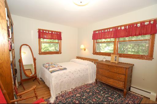 30 48w774 Route Big Rock, IL 60511 - Photo 11 of 16 a bedroom with a bed and a dresser next to a window