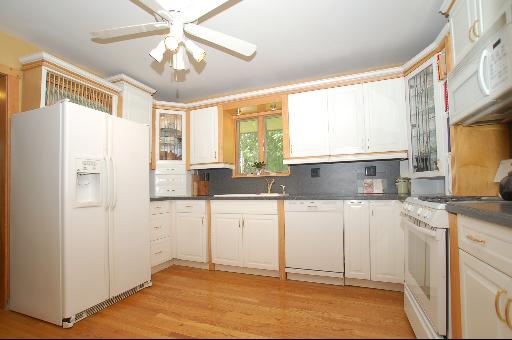 30 48w774 Route Big Rock, IL 60511 - Photo 10 of 16 a kitchen with a refrigerator a sink and dishwasher with wooden floor