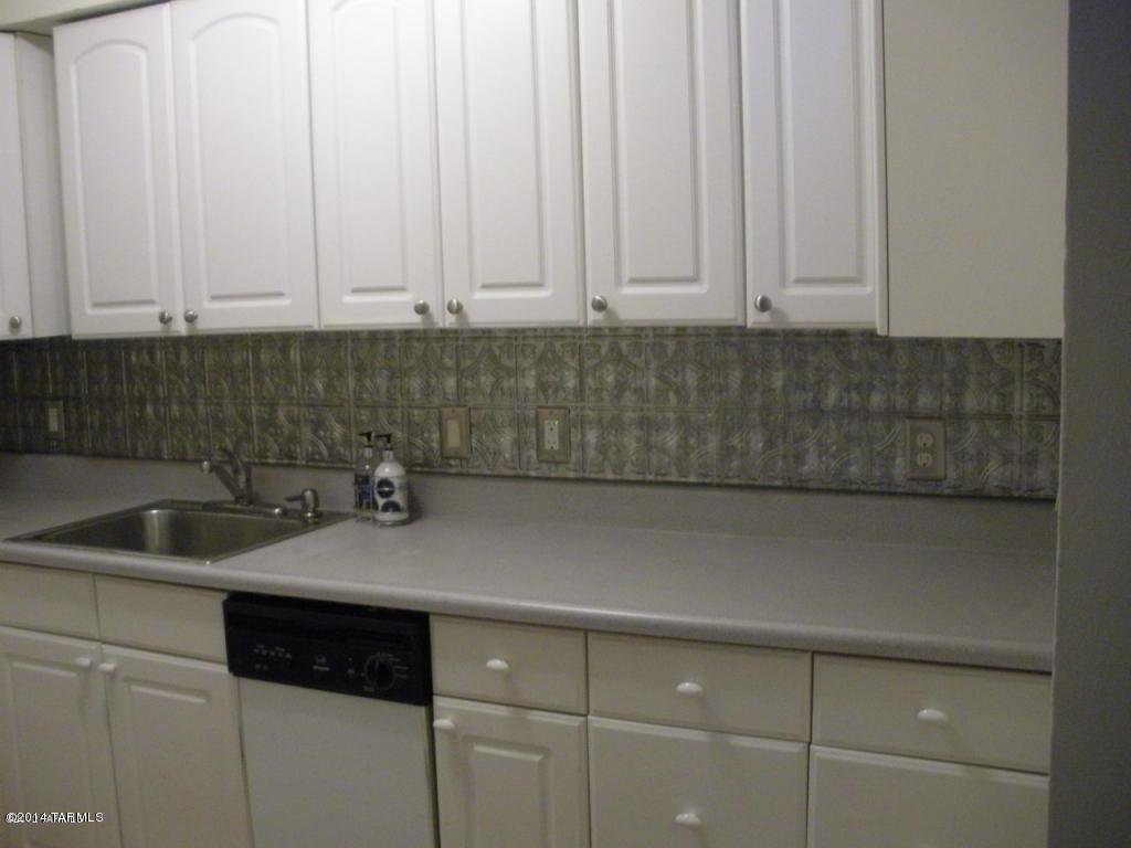1600 North Wilmot Road, Unit 245 Tucson, AZ 85712 - Photo 3 of 12 a kitchen with a sink and cabinets