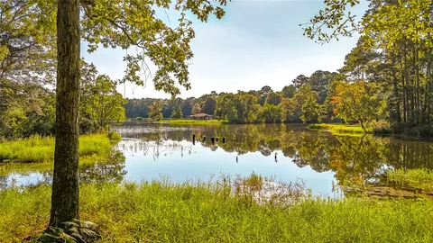 a view of a lake with a house