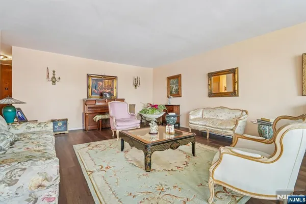 a bedroom with furniture and a large window