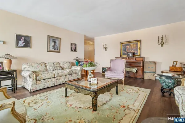 a view of a dining room with furniture and chandelier
