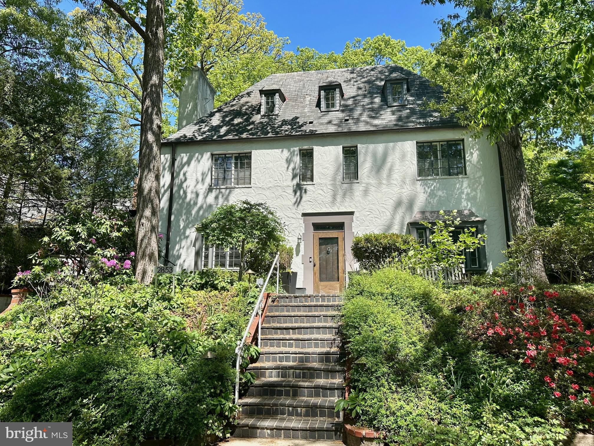 Charming home embraced by lush greenery.