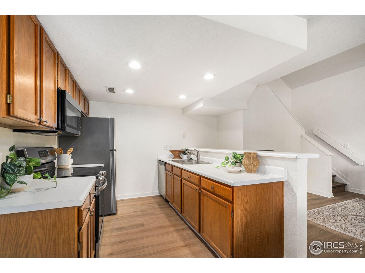 1225 West Prospect Road, Unit R47 Fort Collins, CO 80526 - Photo 11 of 25 Brand new modern appliances bring both style and function to the kitchen.