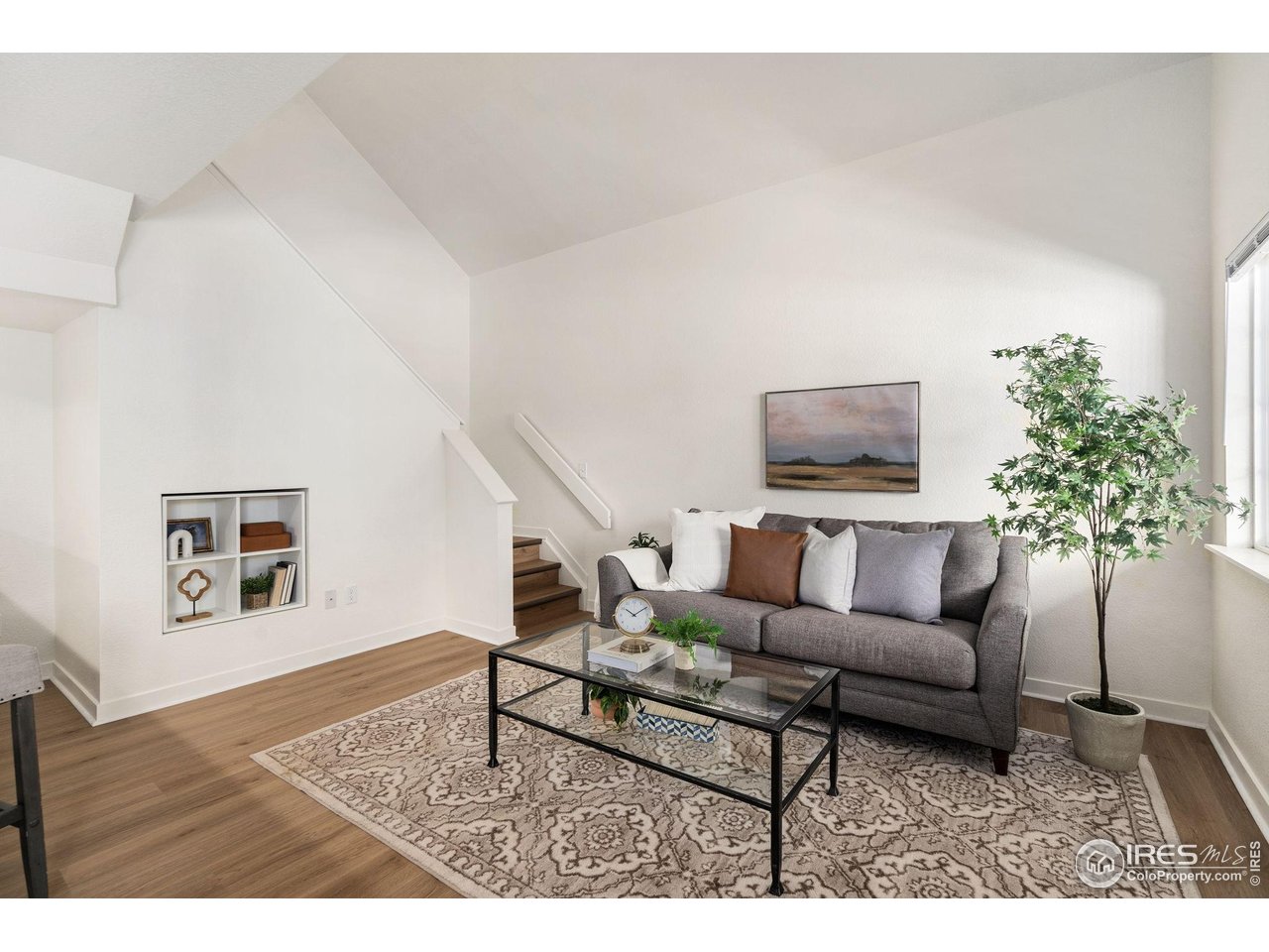 1225 West Prospect Road, Unit R47 Fort Collins, CO 80526 - Photo 5 of 25 Upon entry you are wowed by the bright and fresh living room with new paint and flooring throughout.