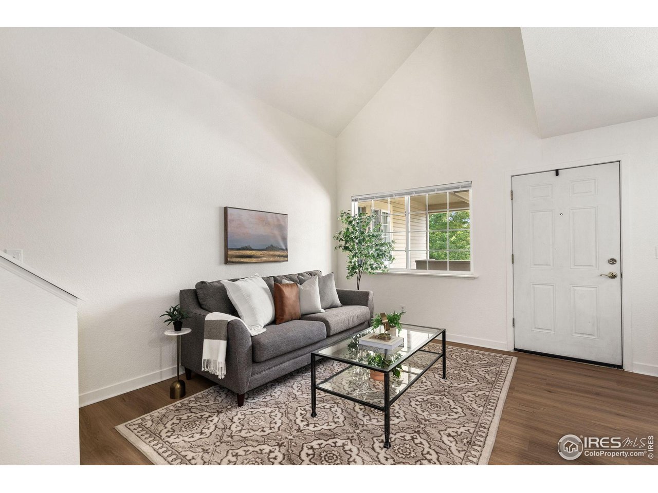1225 West Prospect Road, Unit R47 Fort Collins, CO 80526 - Photo 6 of 25 The vaulted ceilings and windows create an airy and sunlit space.