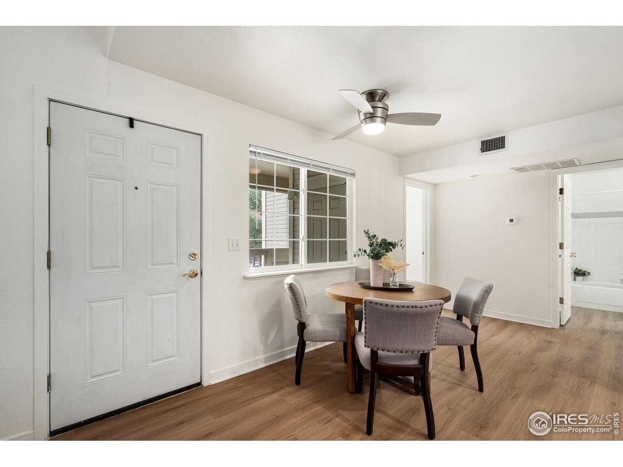 1225 West Prospect Road, Unit R47 Fort Collins, CO 80526 - Photo 9 of 25 Stylish ceiling fans and updated lighting fixtures elevate the home's appeal.