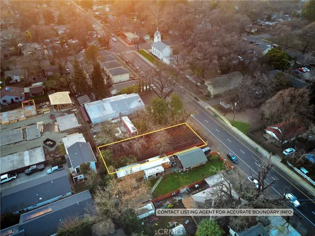 an aerial view of houses with yard