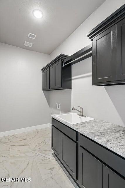 7353 Cimarron Rim Road El Paso, TX 79911 - Photo 11 of 30 a bathroom with a sink and a mirror
