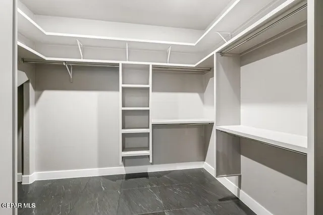 a view of an empty walk in closet
