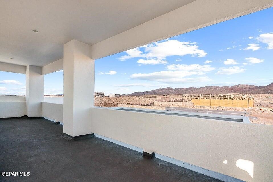 7353 Cimarron Rim Road El Paso, TX 79911 - Photo 27 of 30 a view of a room with an empty room and kitchen view