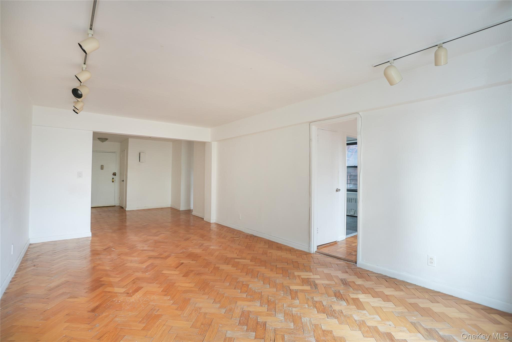 a view of empty room with ceiling fan