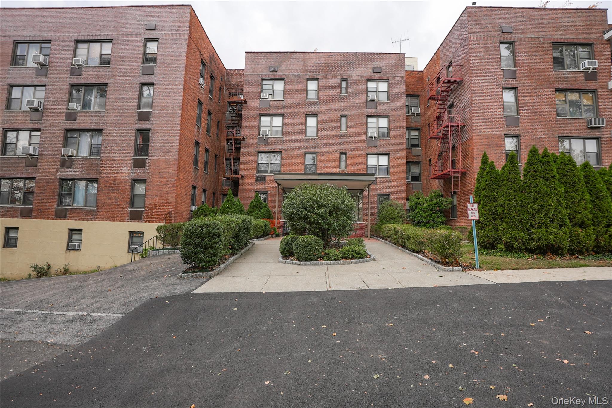 1 Remsen Road, Unit 2F Yonkers, NY 10710 - Photo 14 of 16 a view of a building with a street