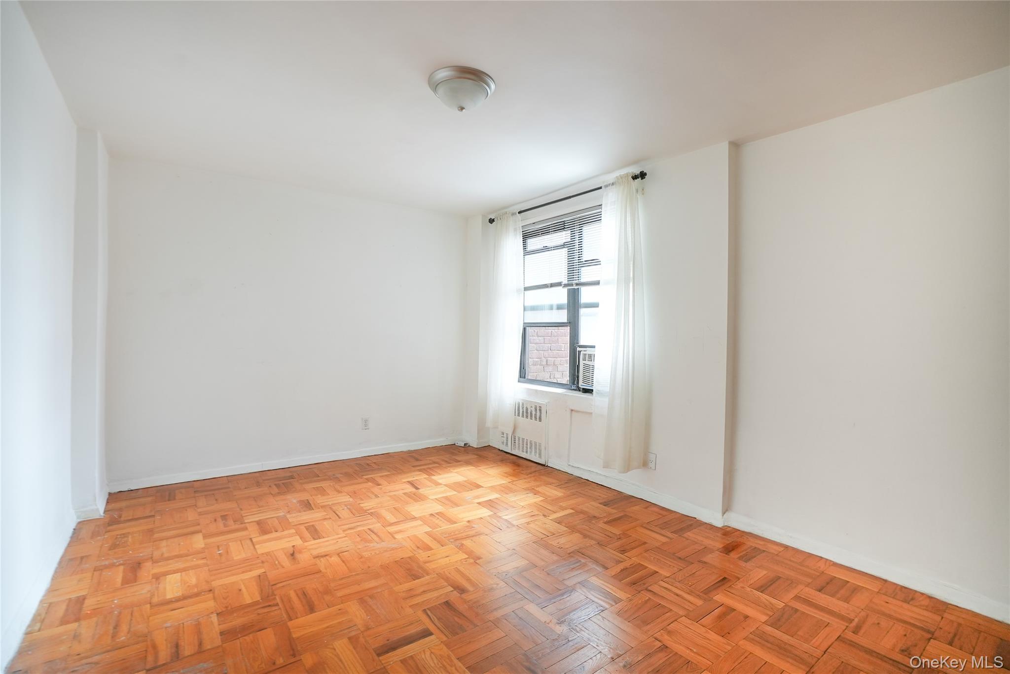 1 Remsen Road, Unit 2F Yonkers, NY 10710 - Photo 4 of 16 a view of empty room with window