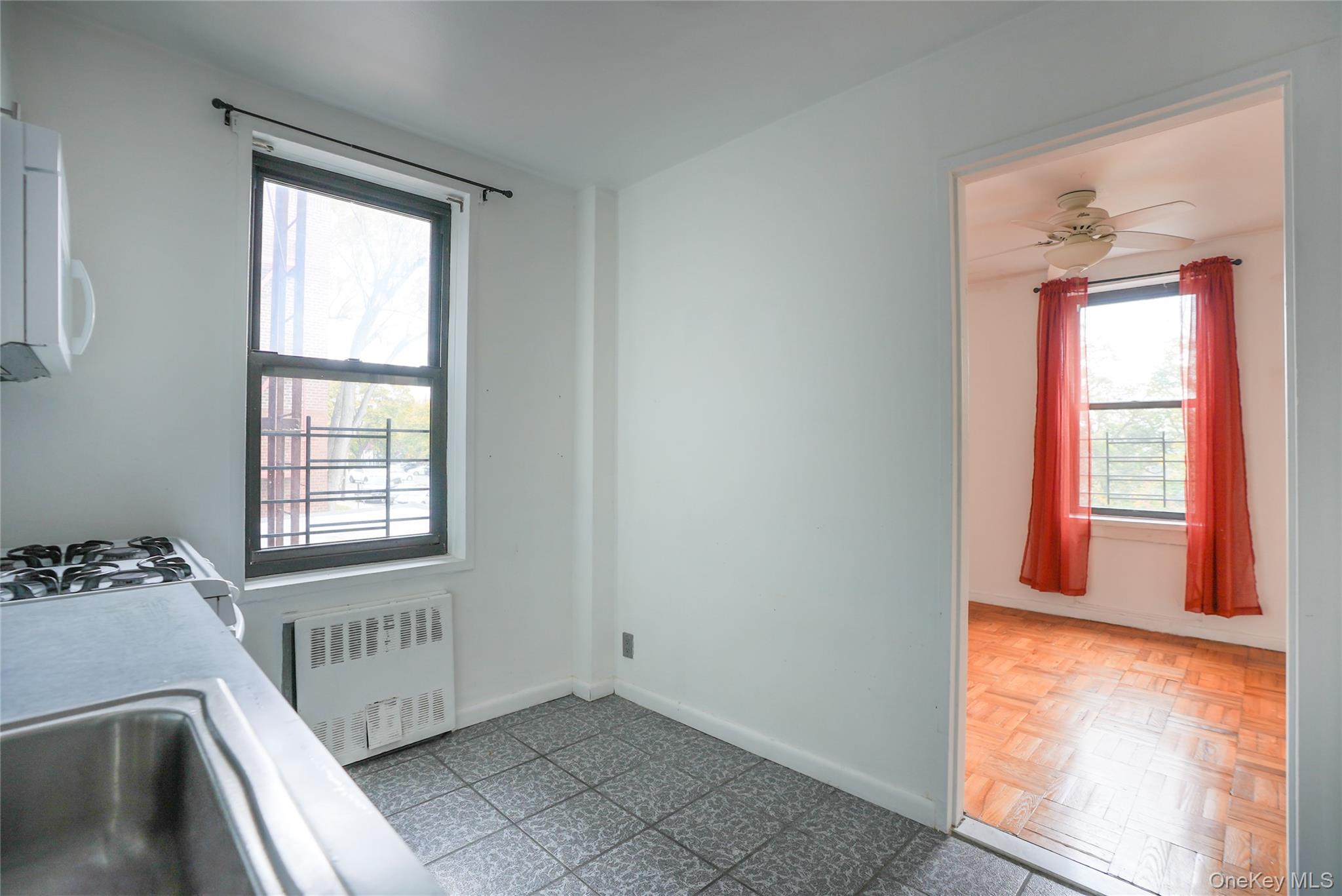1 Remsen Road, Unit 2F Yonkers, NY 10710 - Photo 7 of 16 a view of a room that has a bed and a window in it