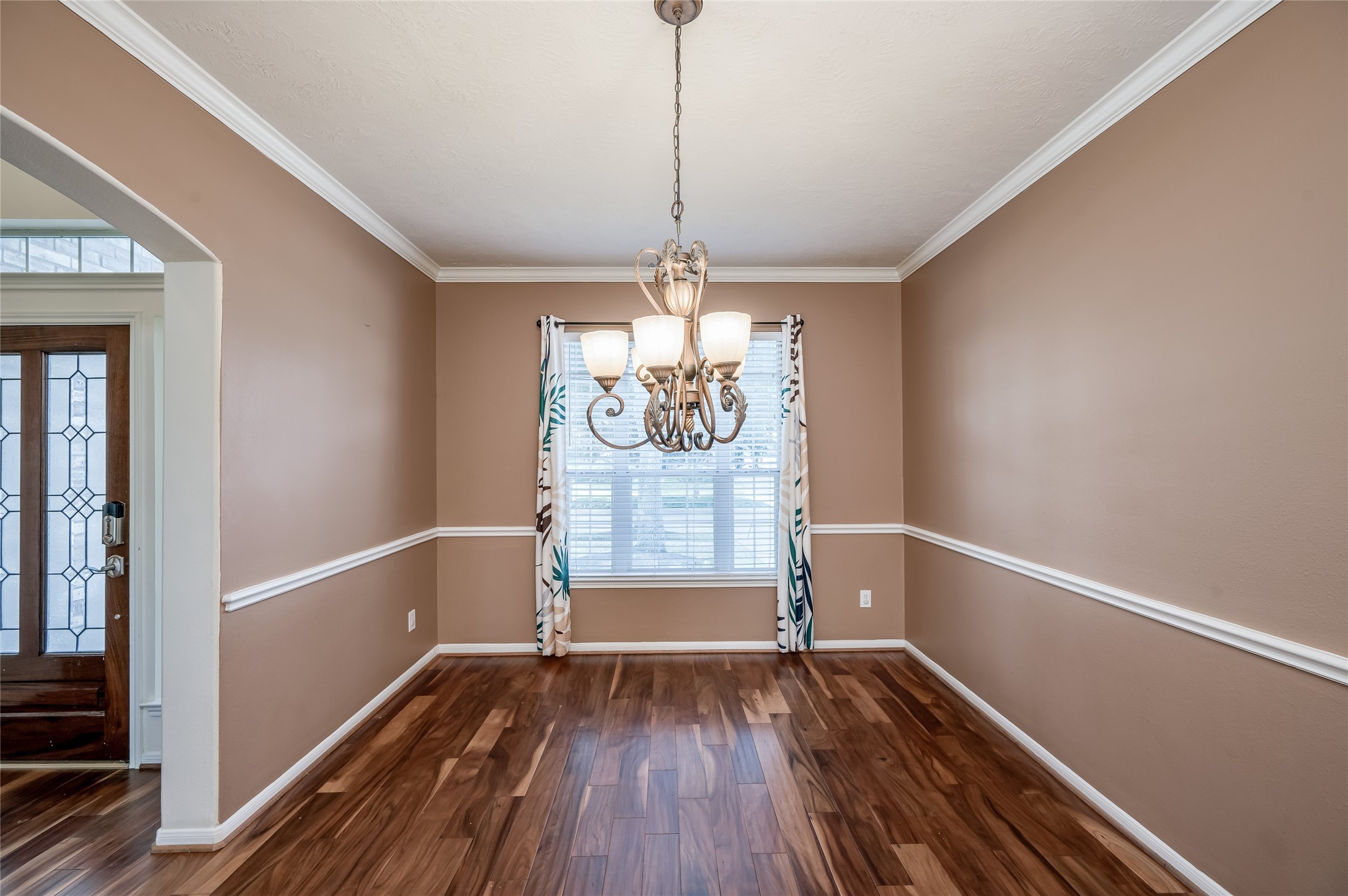 3402 Caloway Court Missouri City, TX 77459 - Photo 5 of 31 a view of a room with wooden floor fan and windows