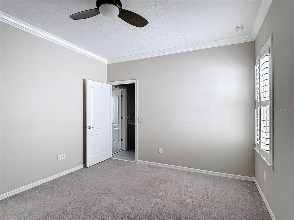 1513 Resolute Street Celebration, FL 34747 - Photo 36 of 43 an empty room with fan and windows