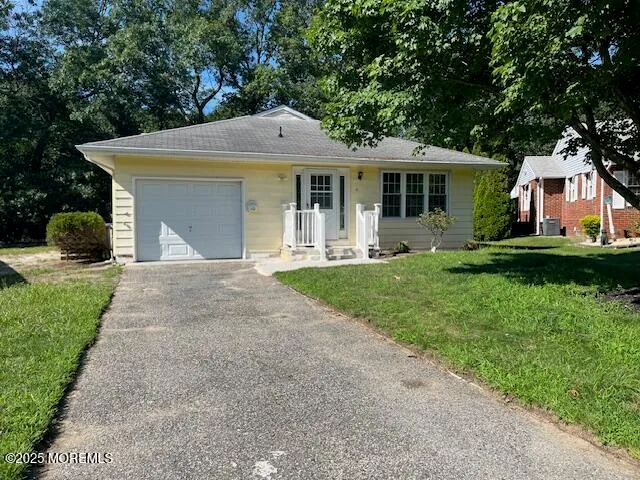 a front view of a house with garden and porch