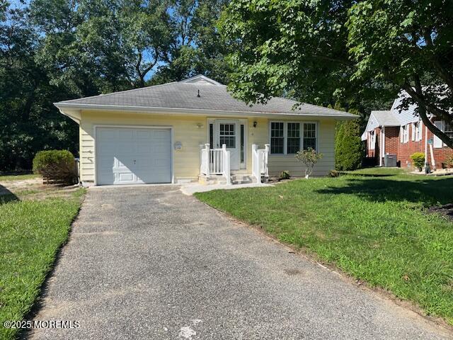 57 Heather Narrows Toms River, NJ 08755 - Photo 1 of 17 a front view of a house with garden and porch