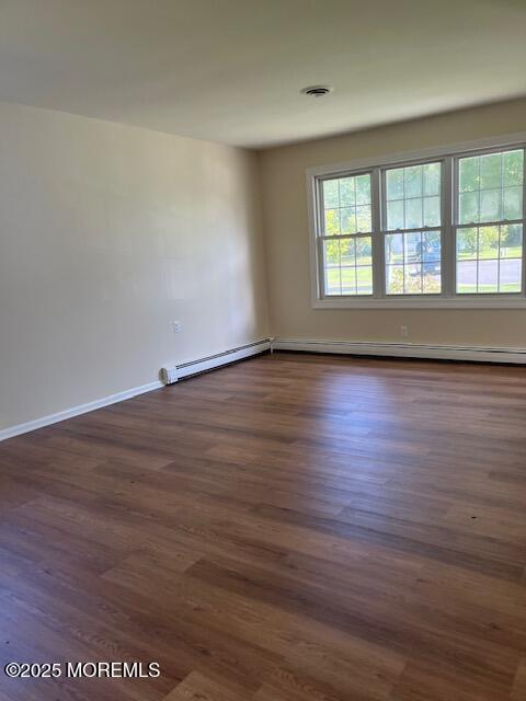 57 Heather Narrows Toms River, NJ 08755 - Photo 6 of 17 wooden floor in an empty room with a window