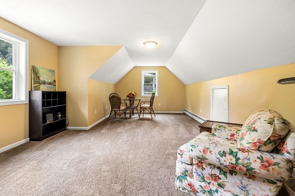 82 Curtis Street Auburn, MA 01501 - Photo 18 of 35 a view of a bedroom with window and furniture