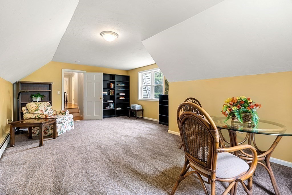 82 Curtis Street Auburn, MA 01501 - Photo 19 of 35 a view of a livingroom with furniture and a porch