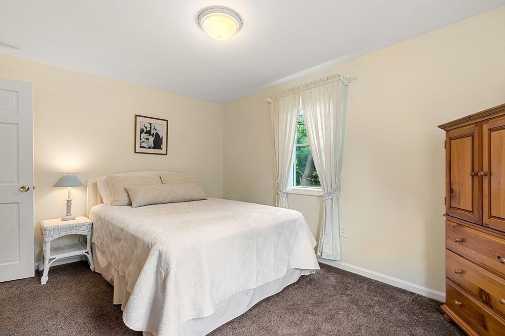 82 Curtis Street Auburn, MA 01501 - Photo 25 of 35 a bedroom with a bed and a window