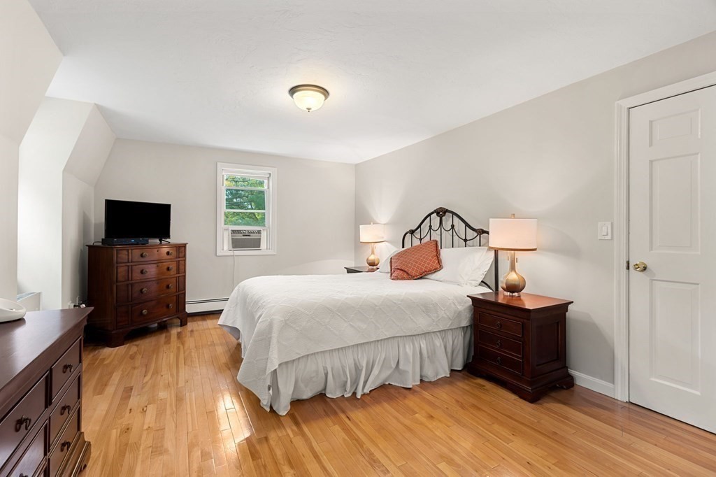 82 Curtis Street Auburn, MA 01501 - Photo 27 of 35 a bedroom with a bed and a tv on table