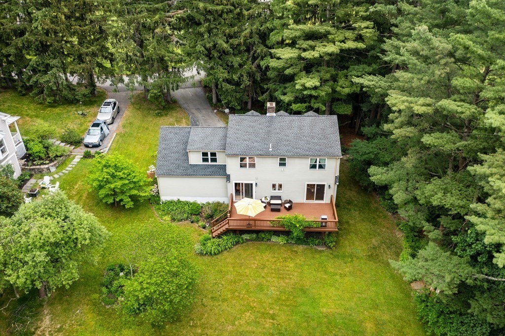 82 Curtis Street Auburn, MA 01501 - Photo 31 of 35 an aerial view of a house with swimming pool a yard and lake view