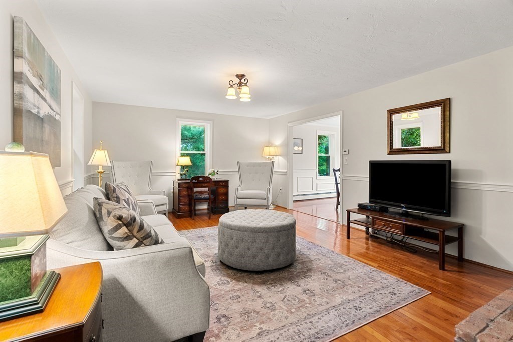 82 Curtis Street Auburn, MA 01501 - Photo 5 of 35 a living room with furniture and a flat screen tv