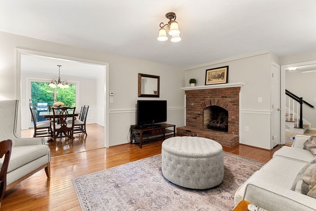 82 Curtis Street Auburn, MA 01501 - Photo 6 of 35 a living room with furniture and a fireplace