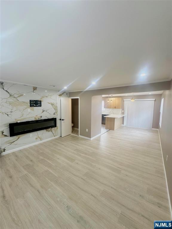 a view of a kitchen with a sink and a refrigerator
