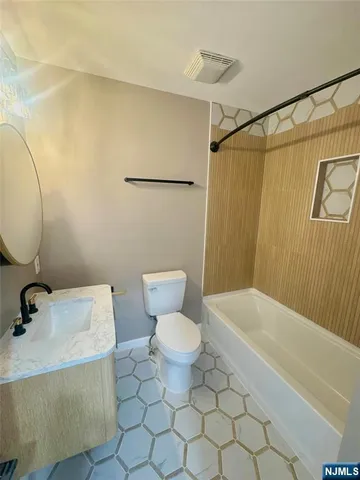 a bathroom with a toilet and a sink