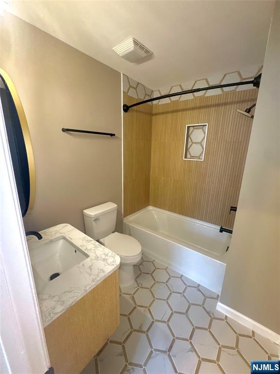 239 40th, Unit 7 Irvington, NJ 07111 - Photo 4 of 8 a bathroom with a sink and a shower