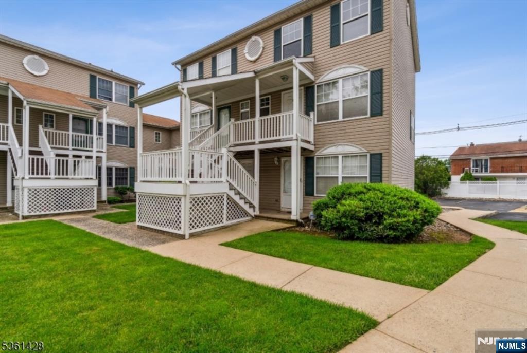 239 40th, Unit 7 Irvington, NJ 07111 - Photo 7 of 8 a view of a house with a yard and plants