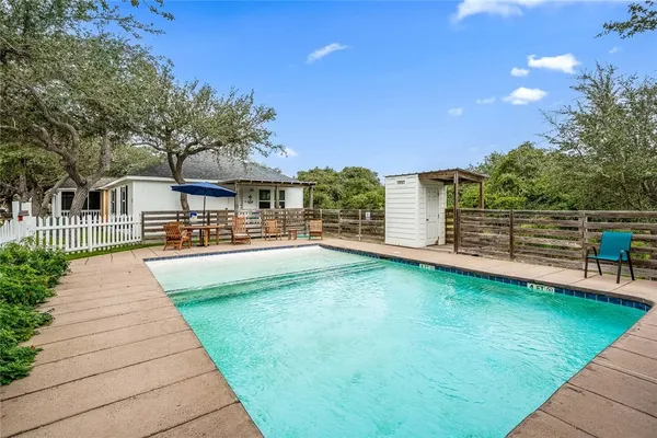 a view of a house with swimming pool