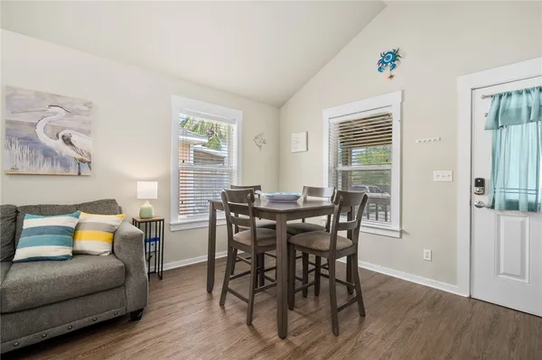 a view of a livingroom with furniture and wooden floor