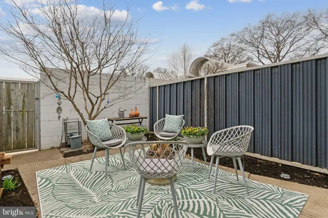 a outdoor space with a couch and chairs