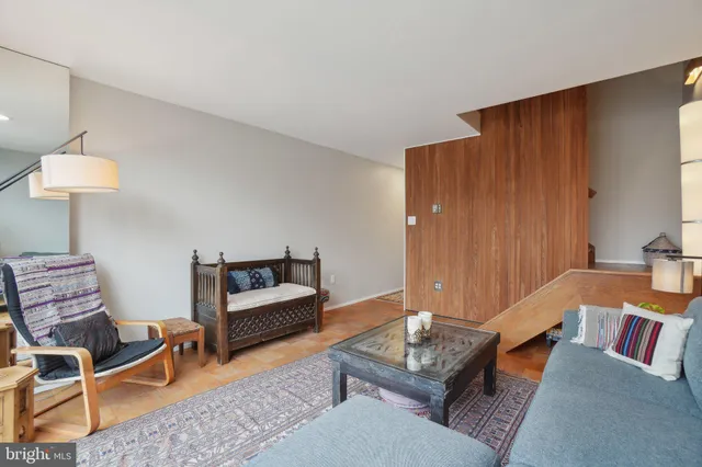 a living room with furniture and a rug