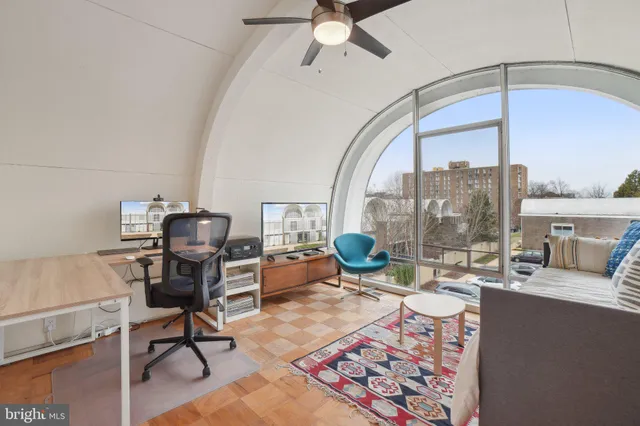 a living room with furniture a rug and a chandelier
