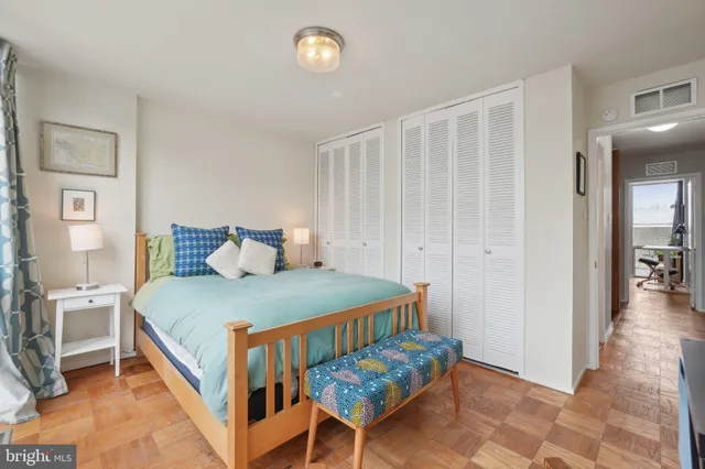 a bedroom with a bed and a table in it