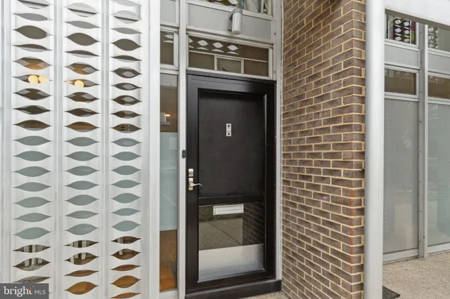 a bathroom with a shower and a sink