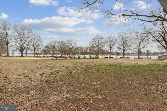 a view of a swimming pool with outdoor seating