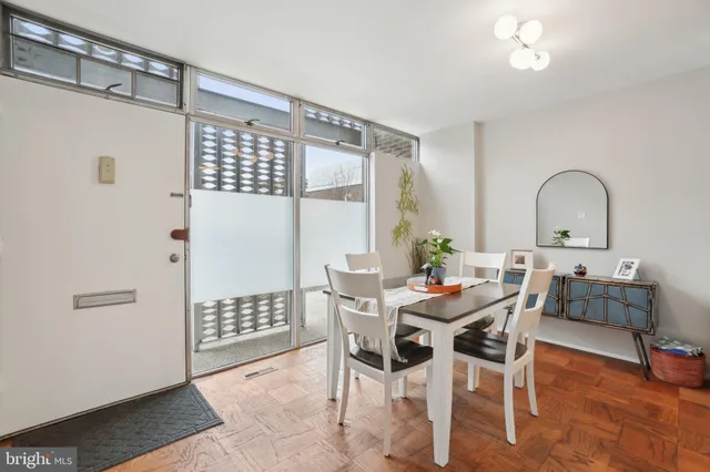 a view of a dining room with furniture and chandelier