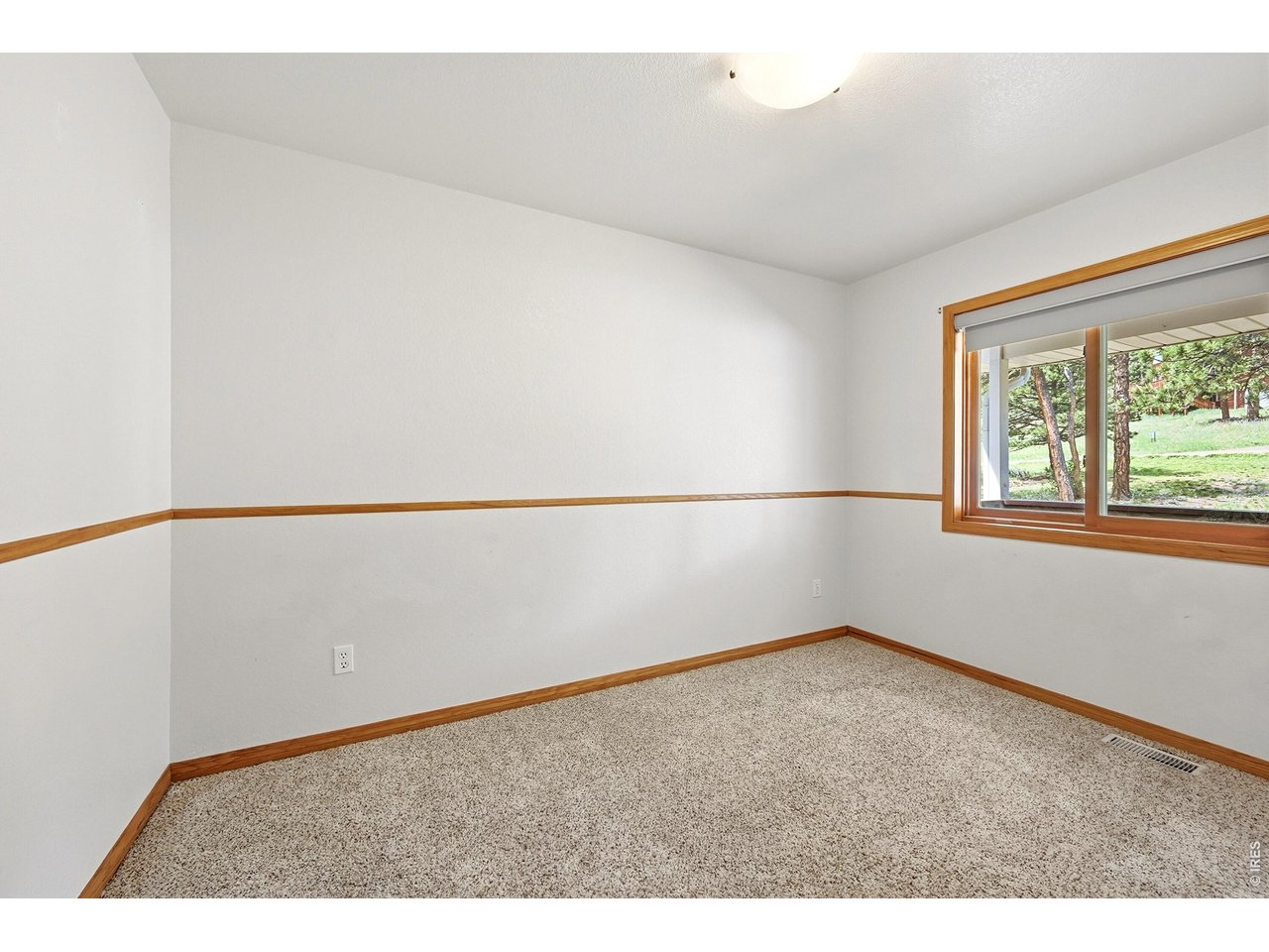 256 Choctaw Road Lyons, CO 80540 - Photo 21 of 50 an empty room with a window
