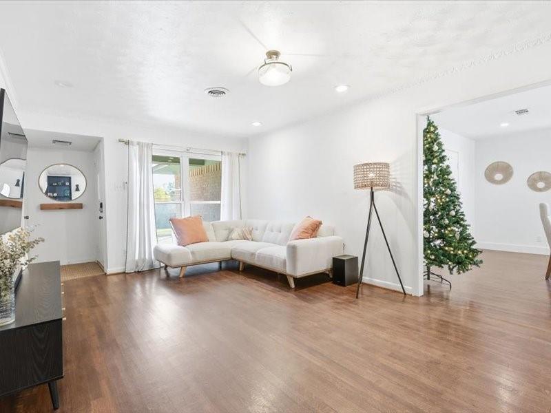 2330 Peavy Place Dallas, TX 75228 - Photo 12 of 39 a living room with furniture and a wooden floor