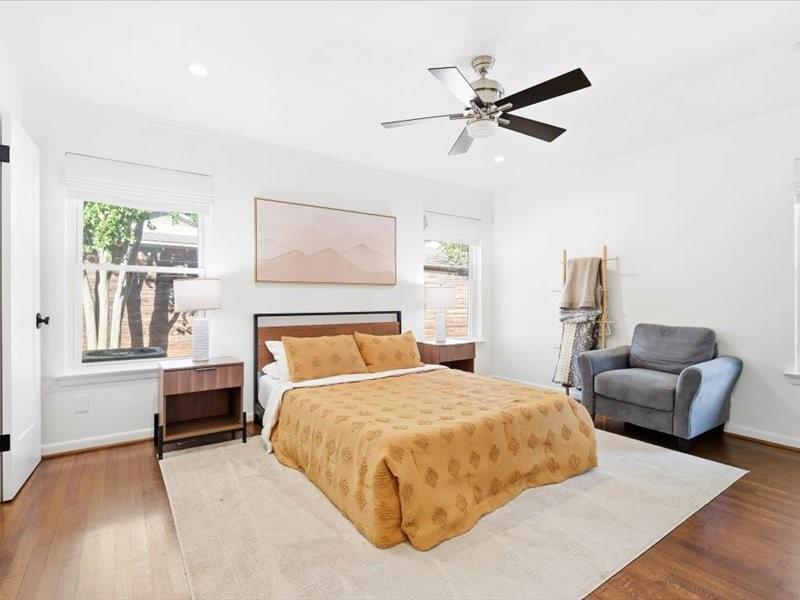 2330 Peavy Place Dallas, TX 75228 - Photo 15 of 39 a bedroom with a bed couches and furniture with wooden floor