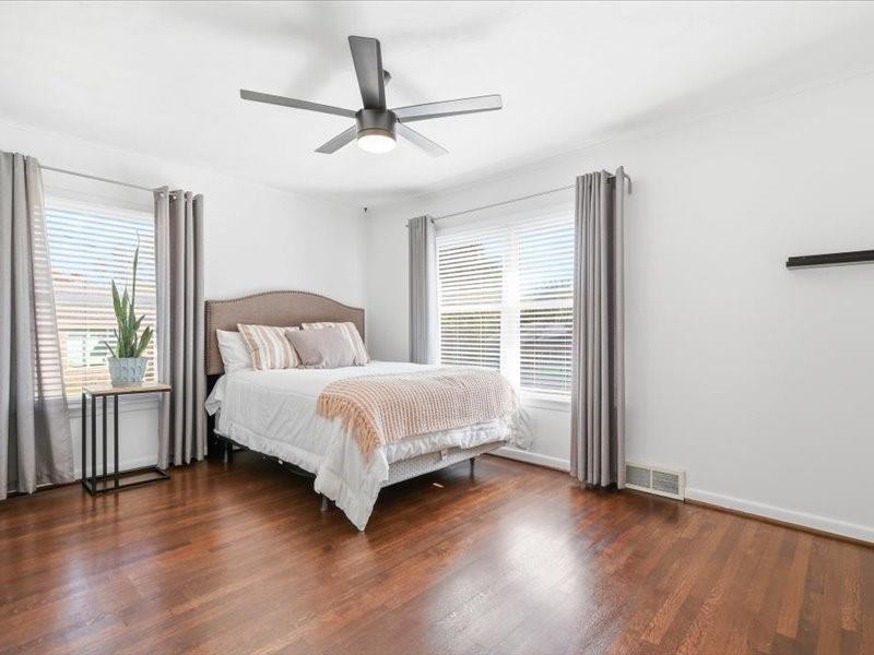 2330 Peavy Place Dallas, TX 75228 - Photo 22 of 39 a bedroom with a bed and wooden floor